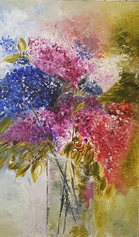 Bouquet de fleurs colorées, incluant des teintes de bleu, rose et vert.